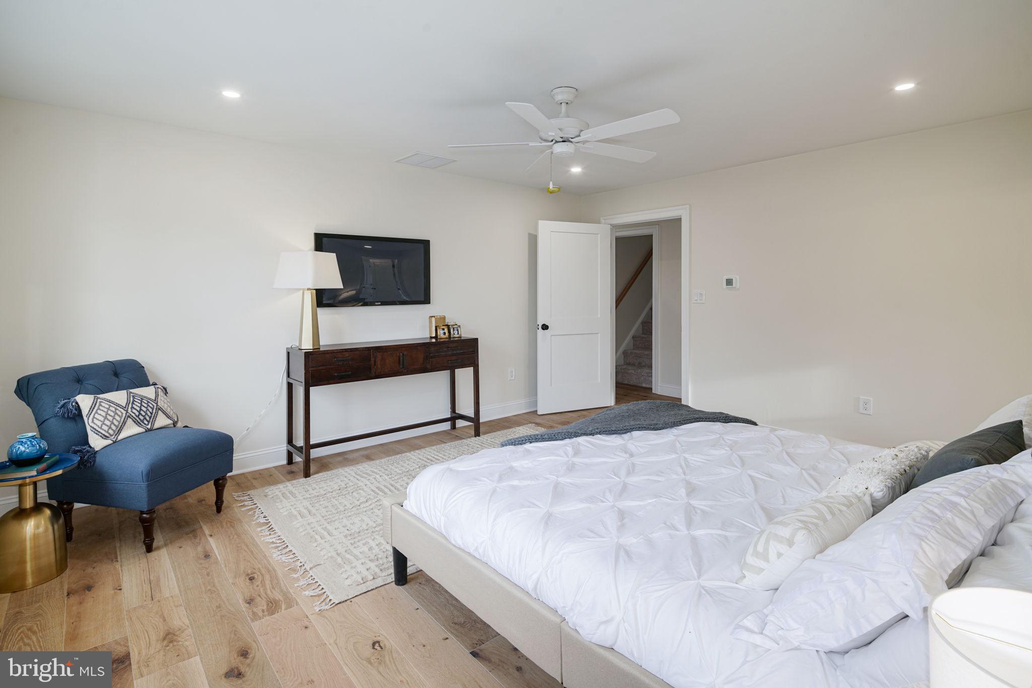 745 Cedar Avenue Haddonfield, NJ 08033 - Photo 29 of 55 a bedroom with a bed and a chair