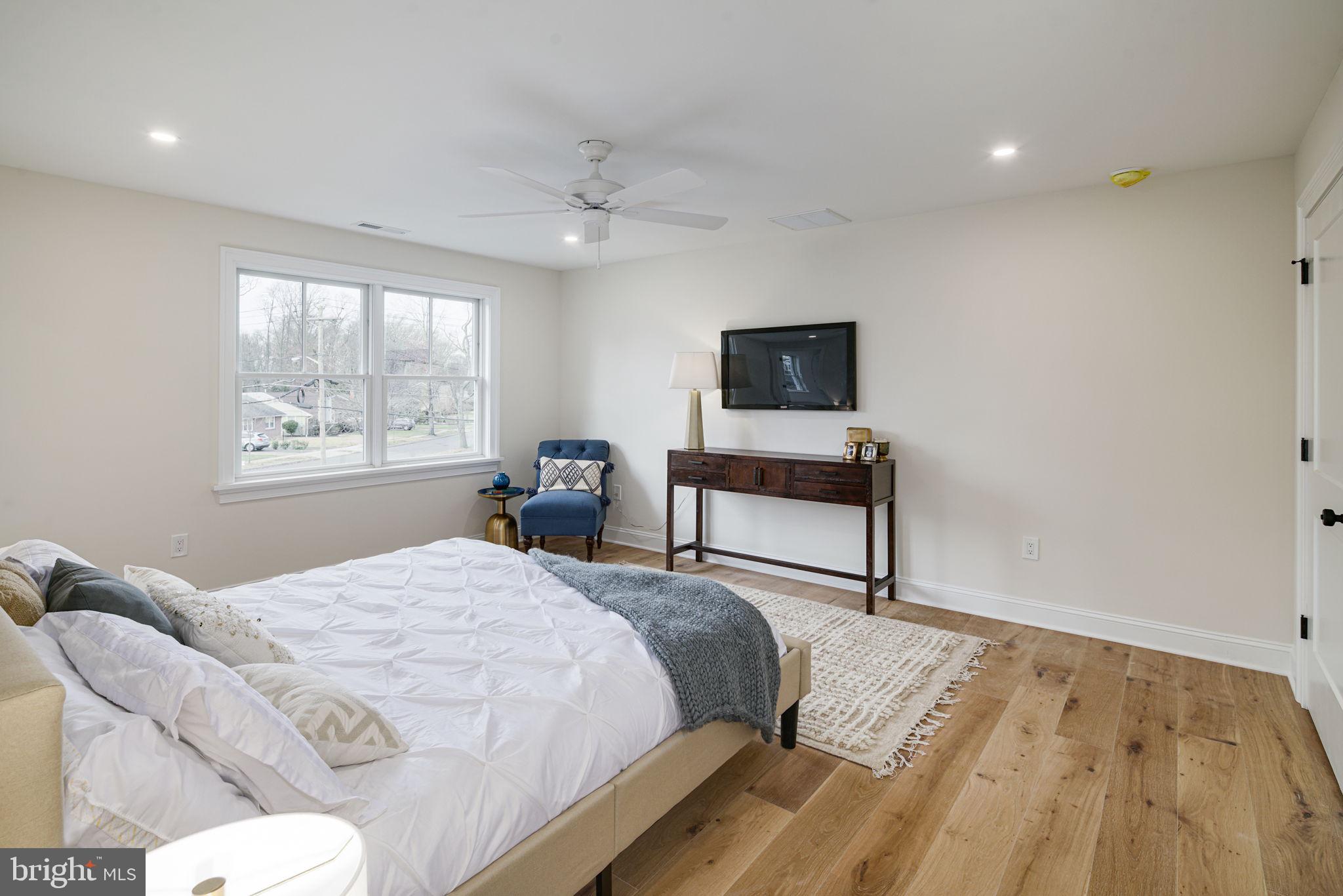 745 Cedar Avenue Haddonfield, NJ 08033 - Photo 30 of 55 a bedroom with a bed and a flat screen tv