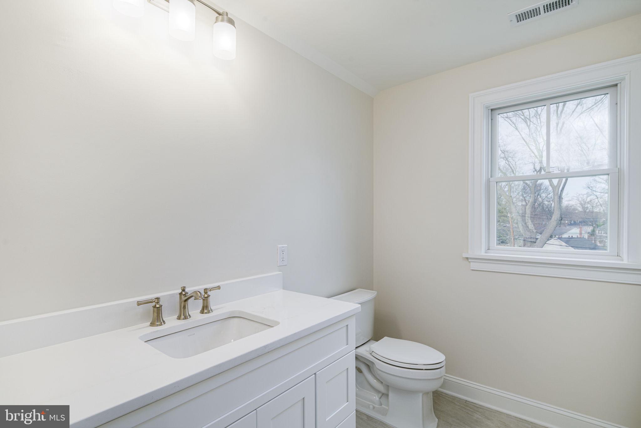 745 Cedar Avenue Haddonfield, NJ 08033 - Photo 43 of 55 a bathroom with a sink vanity mirror and toilet
