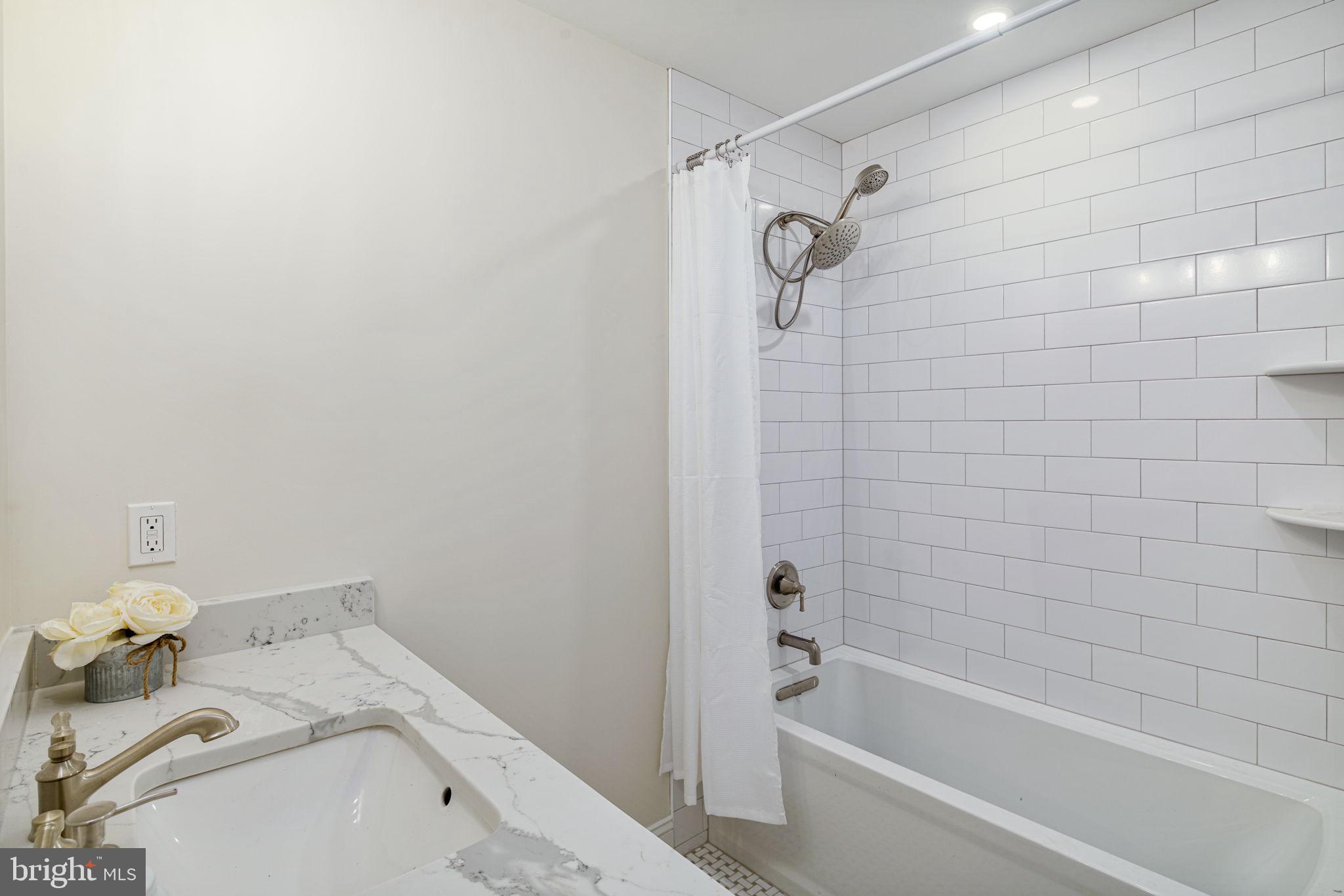 745 Cedar Avenue Haddonfield, NJ 08033 - Photo 45 of 55 a bathroom with a bathtub and shower