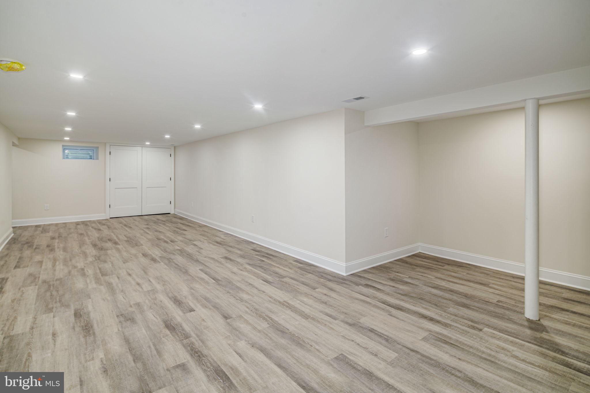745 Cedar Avenue Haddonfield, NJ 08033 - Photo 48 of 55 an empty room with wooden floor and natural light