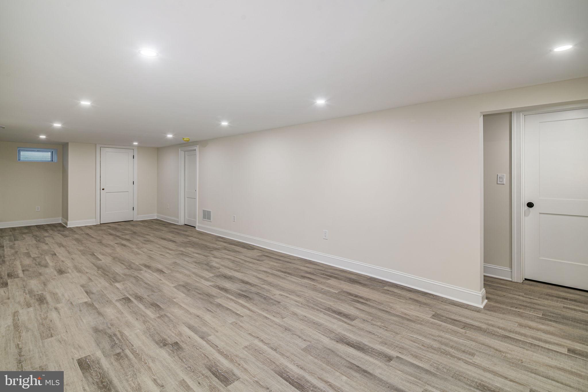 745 Cedar Avenue Haddonfield, NJ 08033 - Photo 49 of 55 an empty room with wooden floor and windows