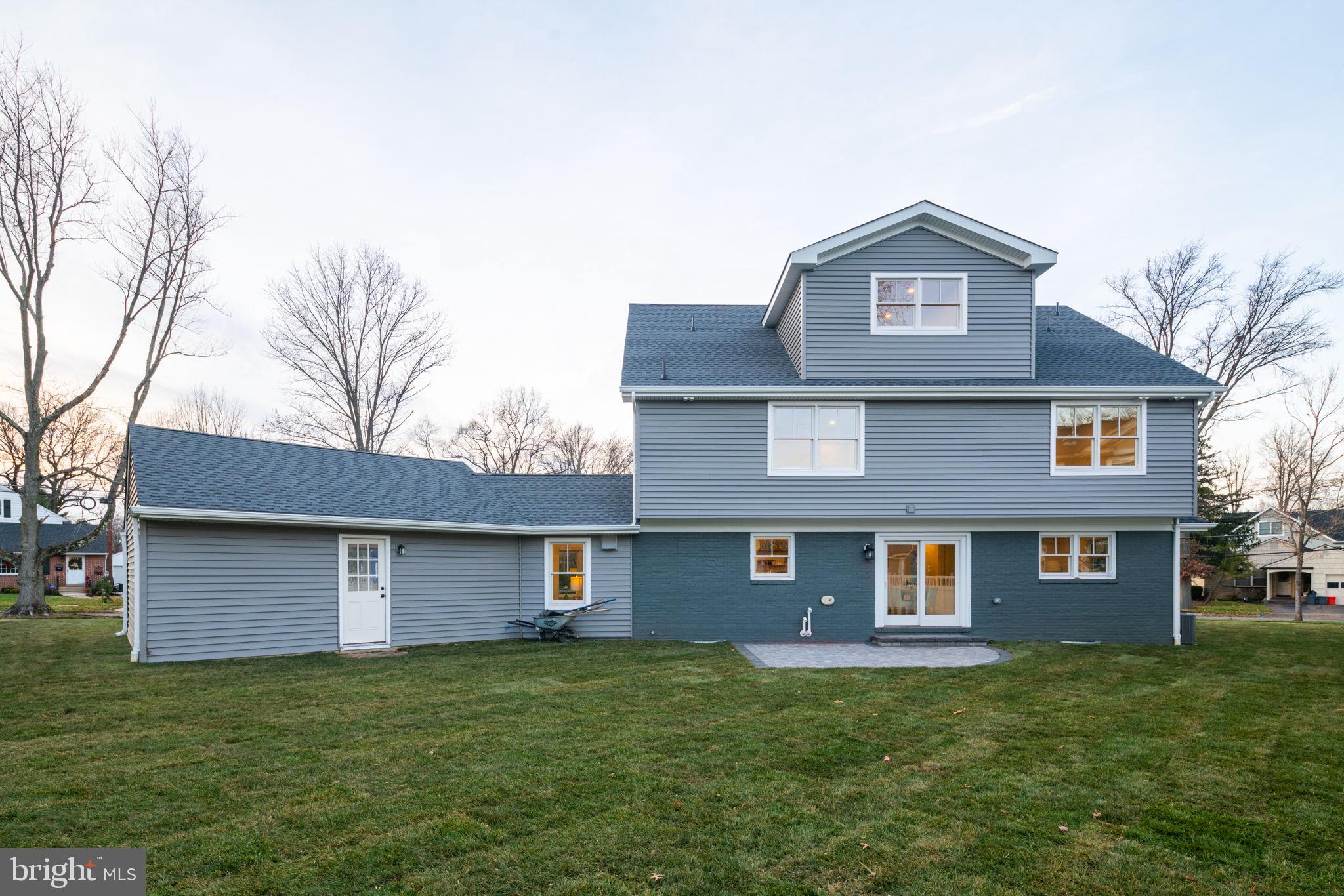 745 Cedar Avenue Haddonfield, NJ 08033 - Photo 51 of 55 a front view of a house with a garden and yard