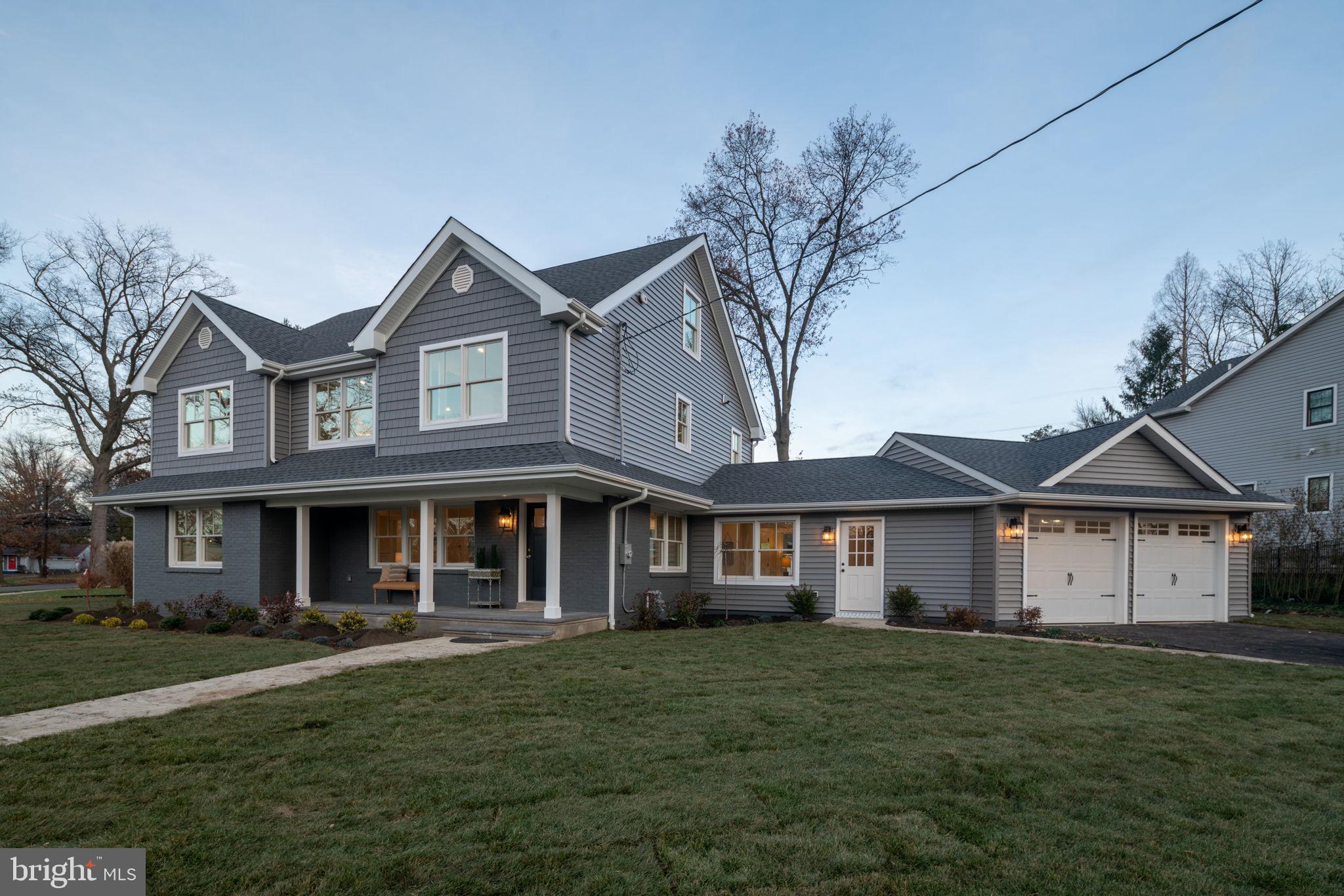 745 Cedar Avenue Haddonfield, NJ 08033 - Photo 6 of 55 a front view of a house with a garden