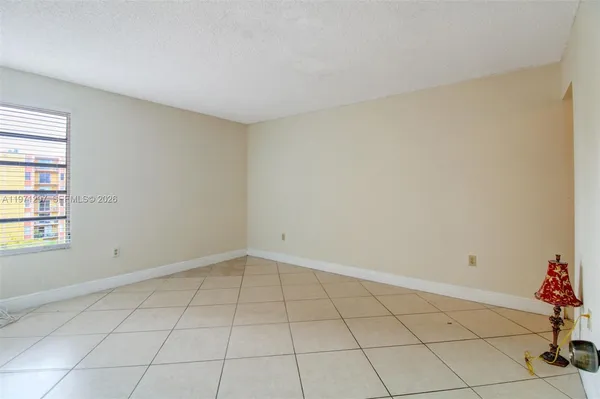 a view of an empty room and window