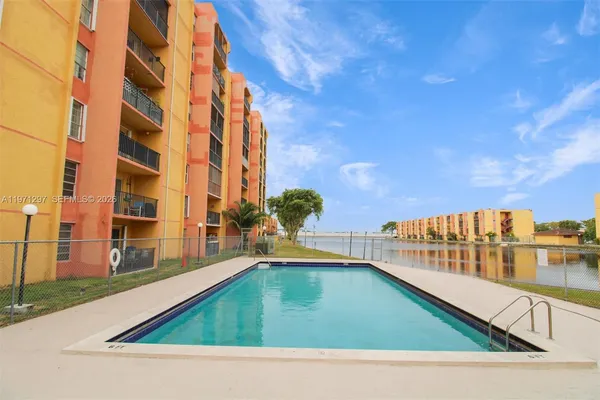 a view of swimming pool from a balcony