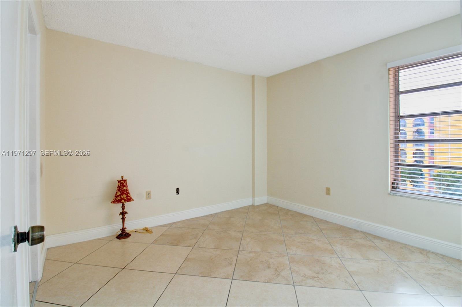4717 Northwest 7th Street, Unit 60410 Miami, FL 33126 - Photo 6 of 19 a view of empty room with wooden floor and fan