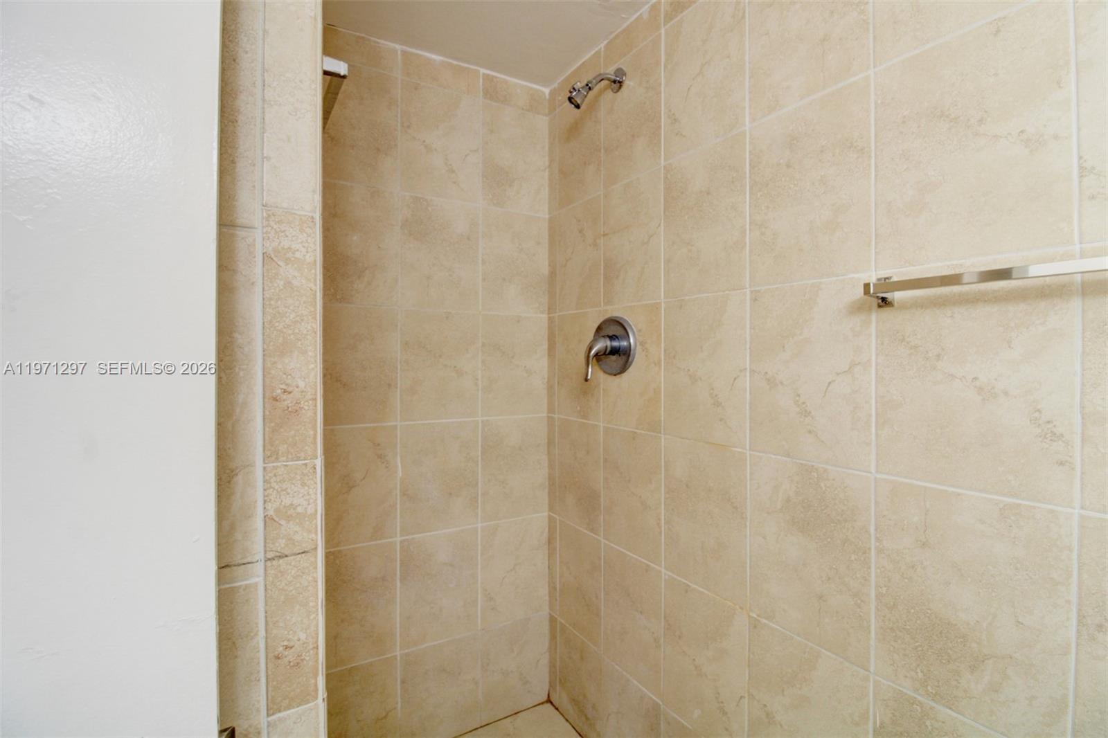 4717 Northwest 7th Street, Unit 60410 Miami, FL 33126 - Photo 8 of 19 a bathroom with a shower