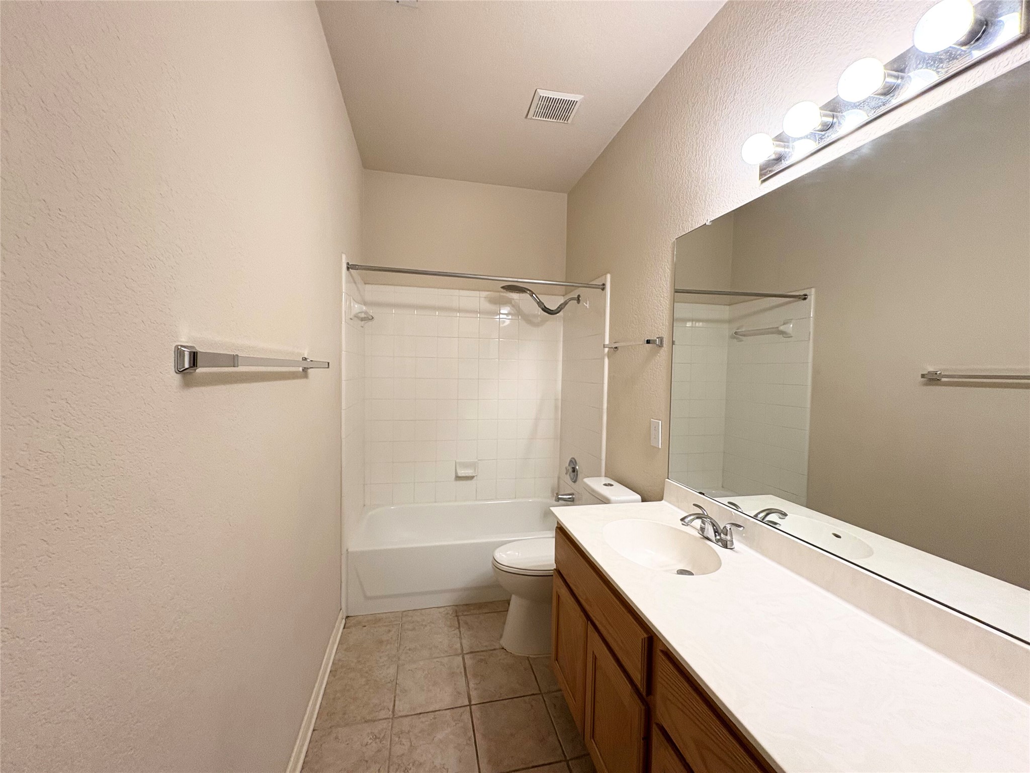 7006 Rambollet Terrace Round Rock, TX 78681 - Photo 29 of 38 This bathroom features a full-sized vanity with ample counter space and a classic tub/shower combination.
