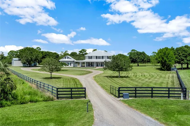 a view of a park with large trees