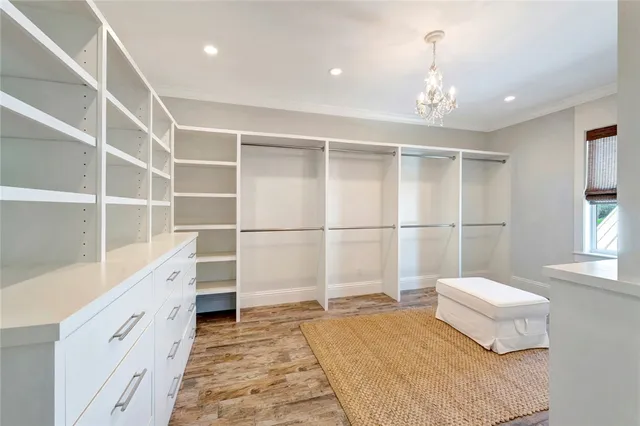 a spacious bedroom with a bed and a window