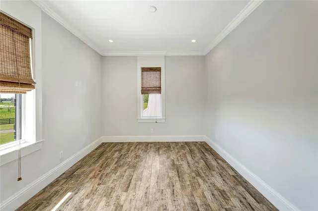 a view of room with window and hardwood floor