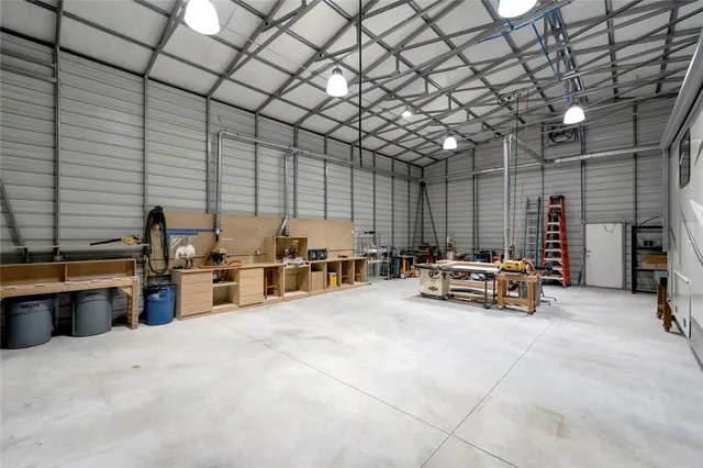 a view of a patio with table and chairs