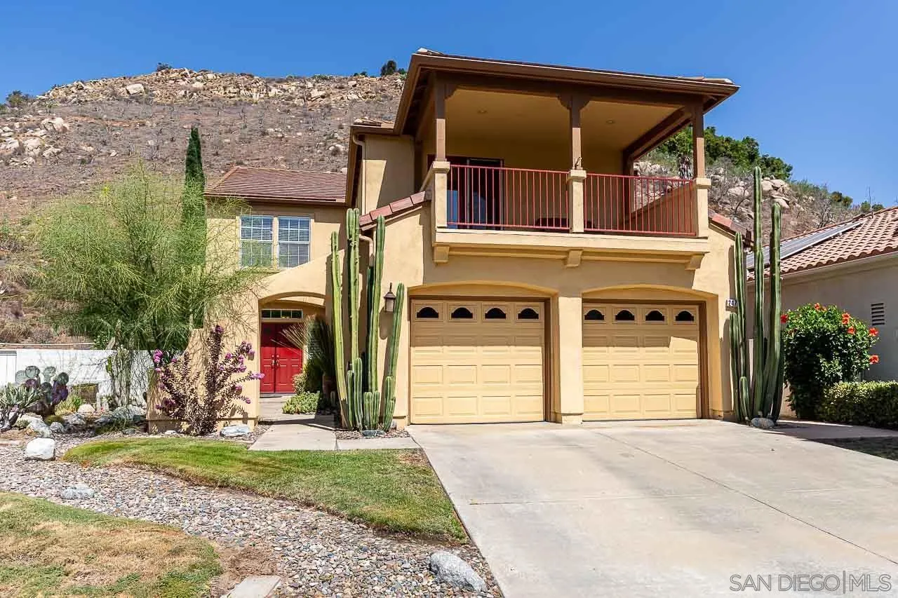 2477 Fallbrook Place Escondido, CA 92027 - Photo 1 of 28 a front view of a house with a yard and garage