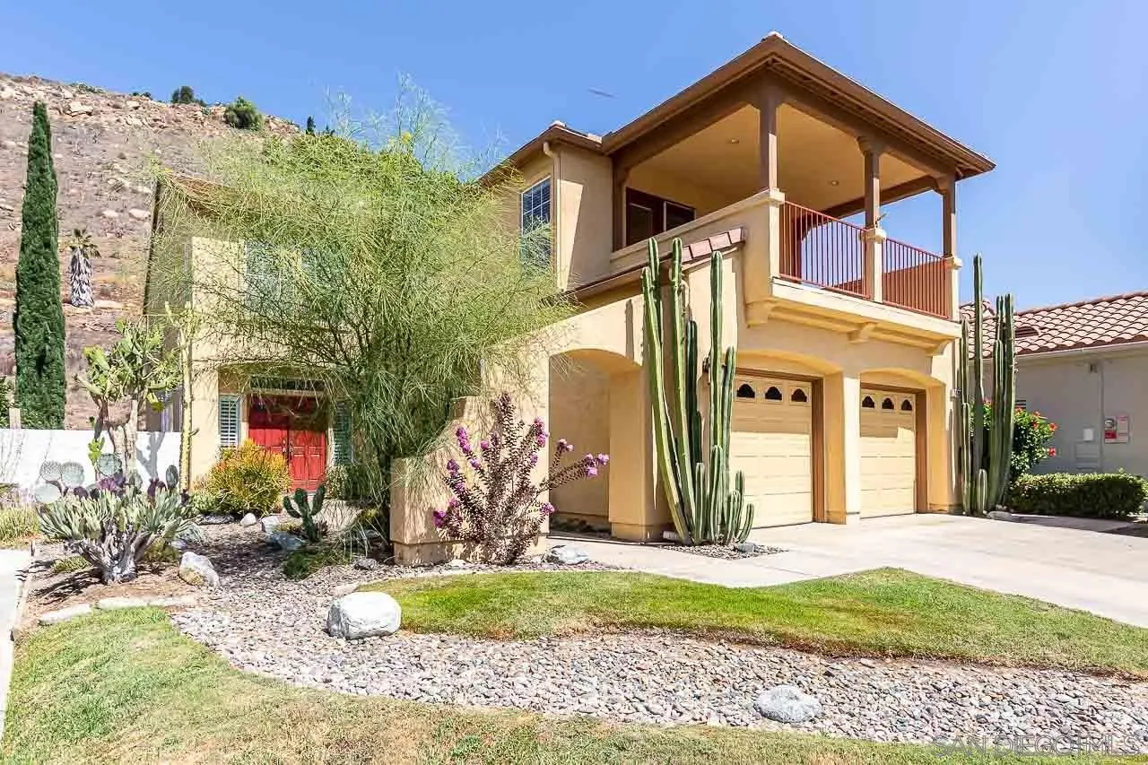 2477 Fallbrook Place Escondido, CA 92027 - Photo 2 of 28 a front view of a house with a yard