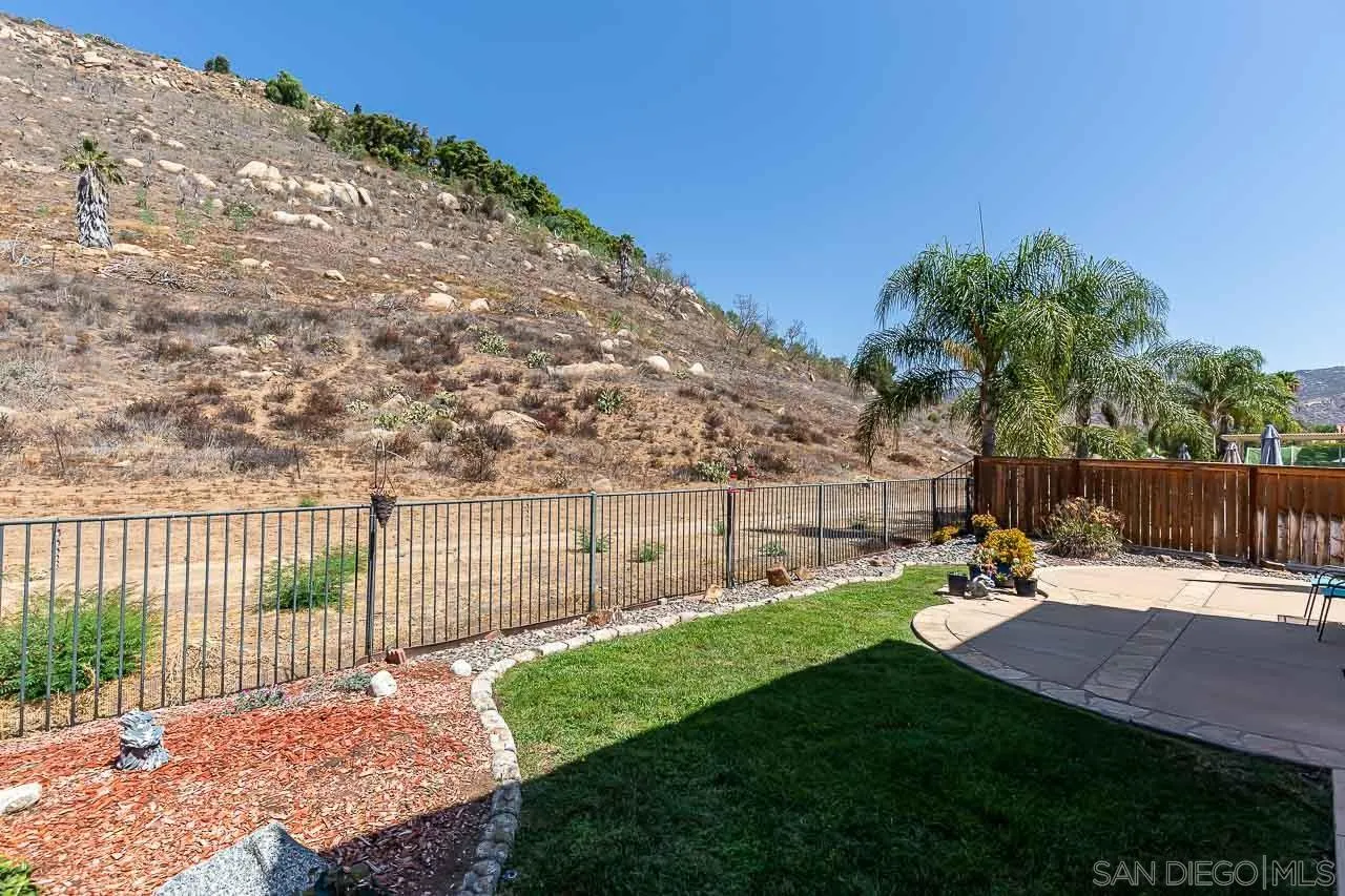 2477 Fallbrook Place Escondido, CA 92027 - Photo 27 of 28 a garden view with a seating space