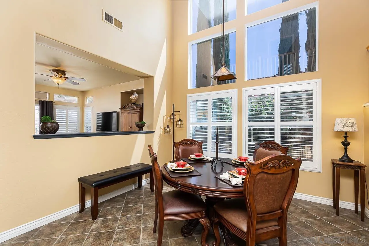 2477 Fallbrook Place Escondido, CA 92027 - Photo 3 of 28 a view of a dining room with furniture and windows