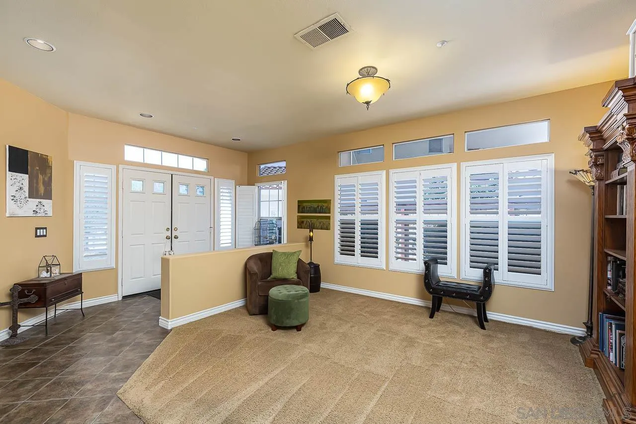 2477 Fallbrook Place Escondido, CA 92027 - Photo 5 of 28 a living room with furniture and a large window
