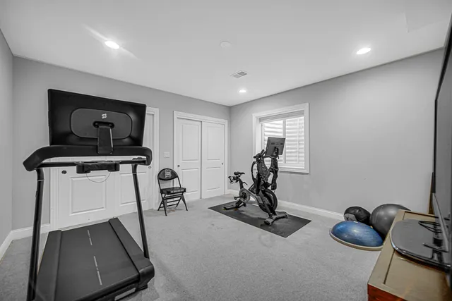 a room with gym equipment and equipment