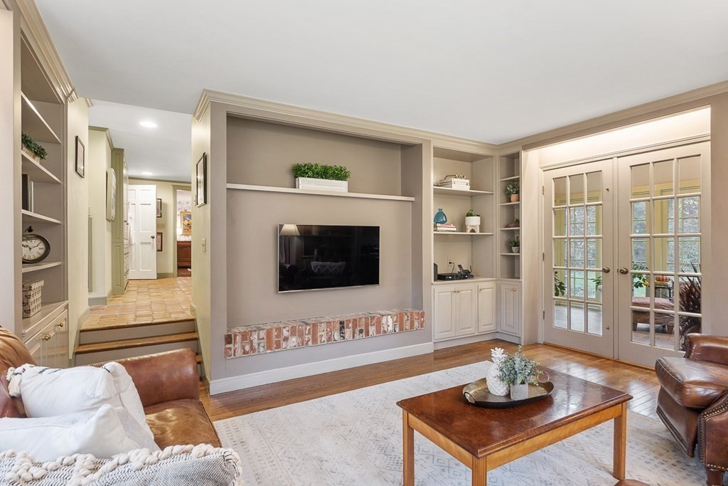 34 Barretts Mill Road Concord, MA 01742 - Photo 13 of 40 a living room with furniture and a flat screen tv