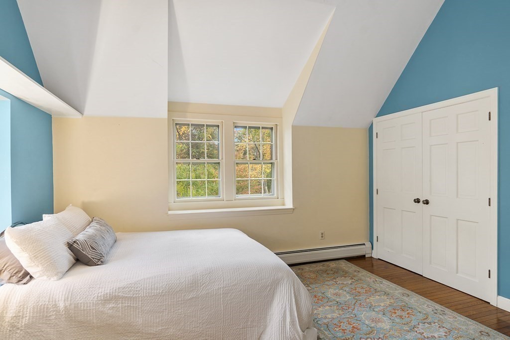 34 Barretts Mill Road Concord, MA 01742 - Photo 18 of 40 a bedroom with a bed and a window