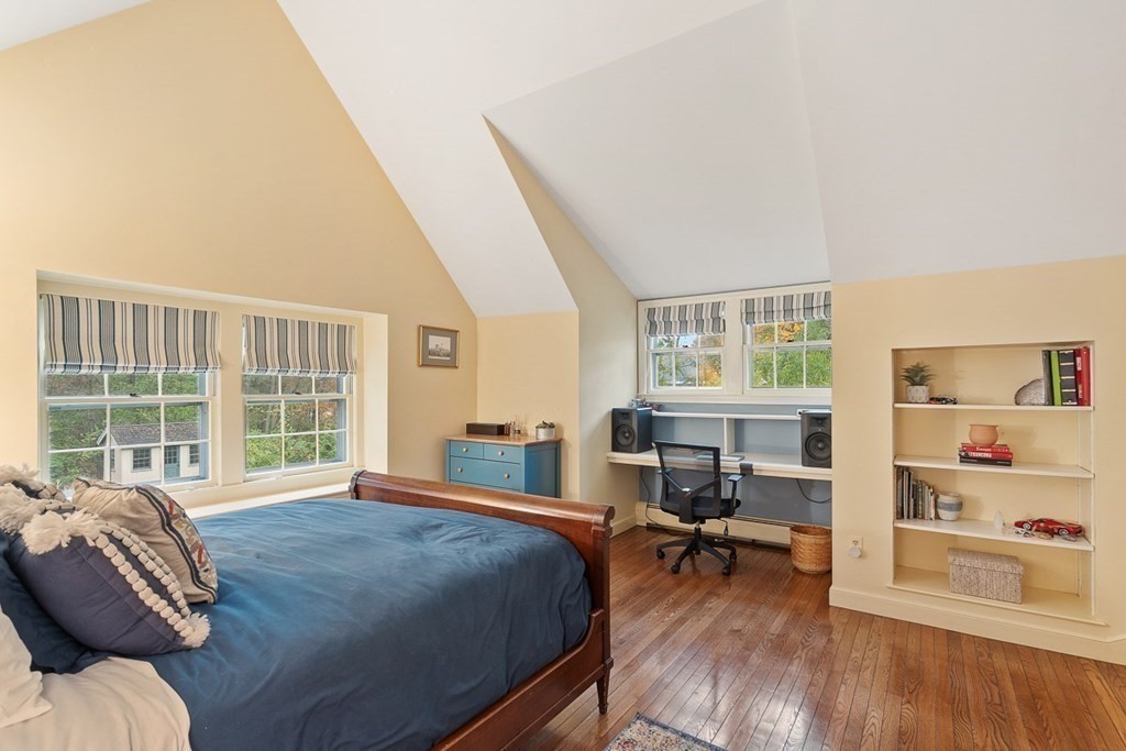 34 Barretts Mill Road Concord, MA 01742 - Photo 21 of 40 a bedroom with a bed and wooden floor