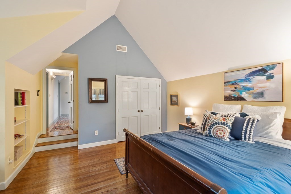 34 Barretts Mill Road Concord, MA 01742 - Photo 22 of 40 a bedroom with a bed and wooden floor