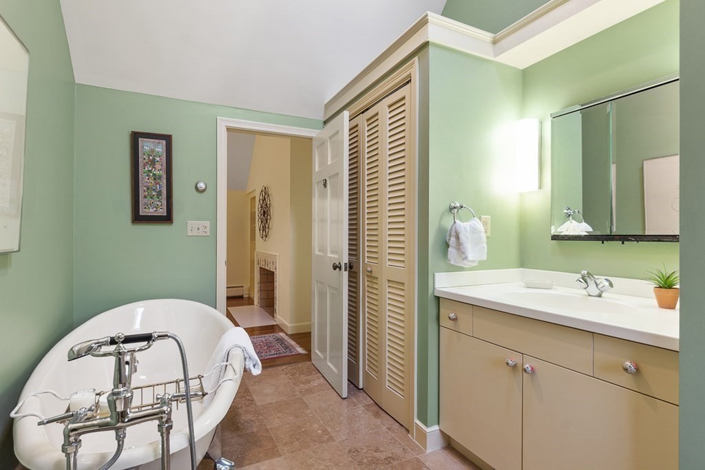 34 Barretts Mill Road Concord, MA 01742 - Photo 27 of 40 a bathroom with a sink and mirror