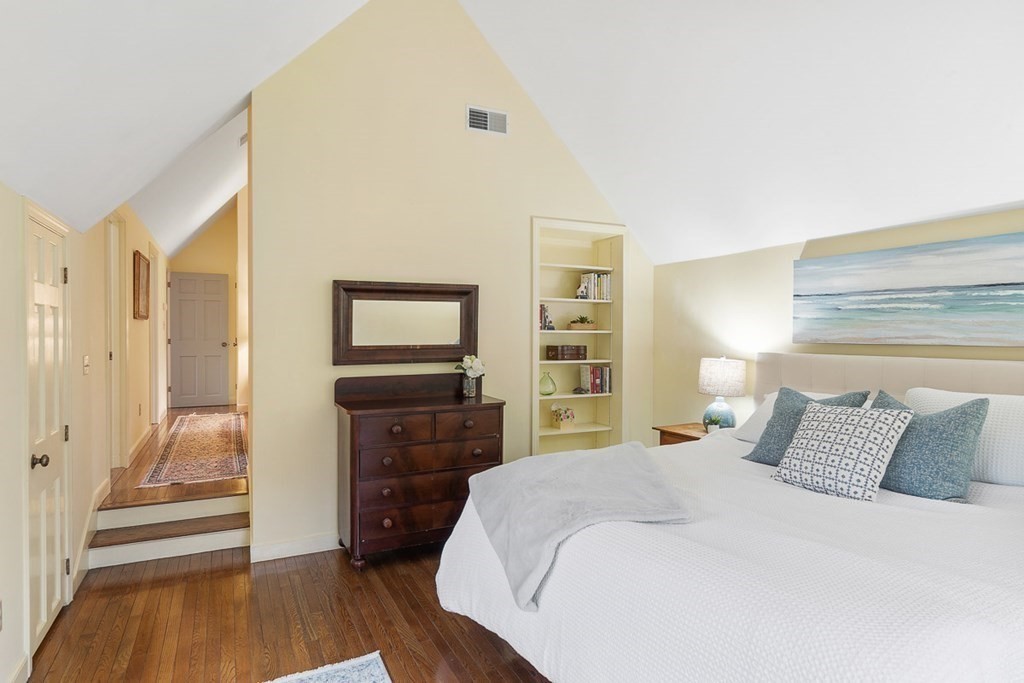 34 Barretts Mill Road Concord, MA 01742 - Photo 29 of 40 a bedroom with a bed and wooden floor