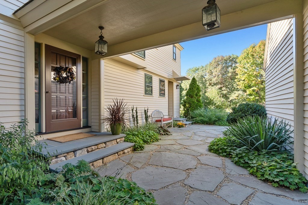 34 Barretts Mill Road Concord, MA 01742 - Photo 3 of 40 a front view of a house with garden