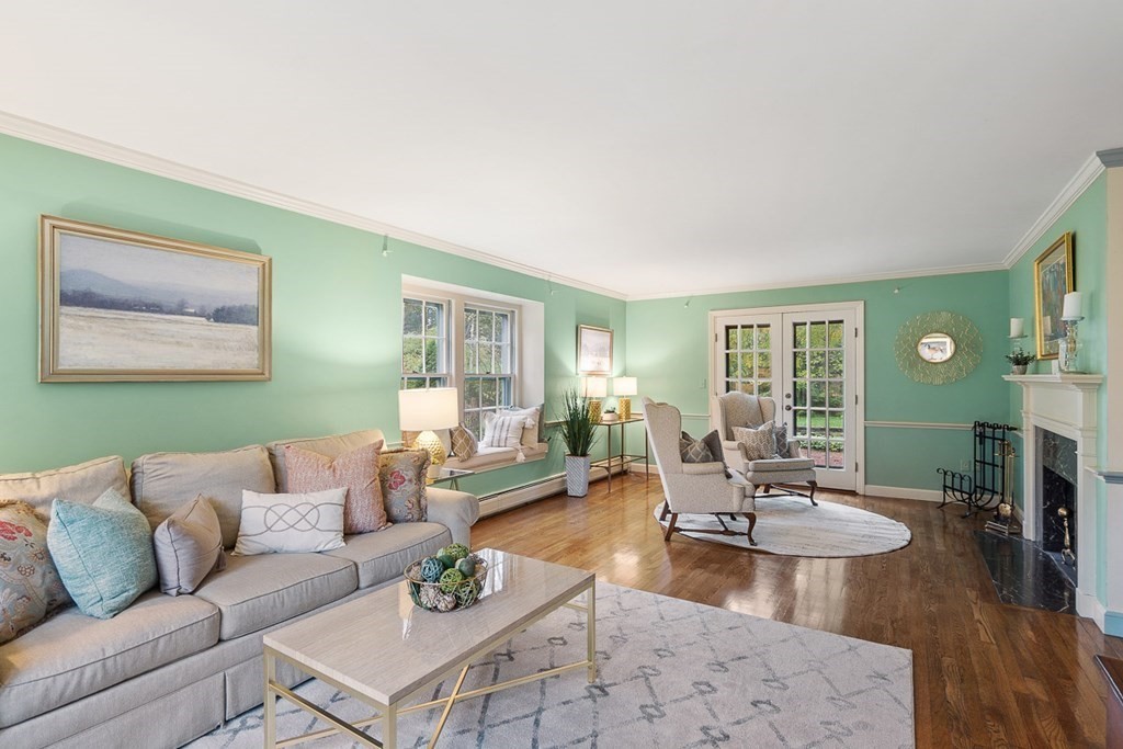 34 Barretts Mill Road Concord, MA 01742 - Photo 5 of 40 a living room with fireplace furniture and a wooden floor