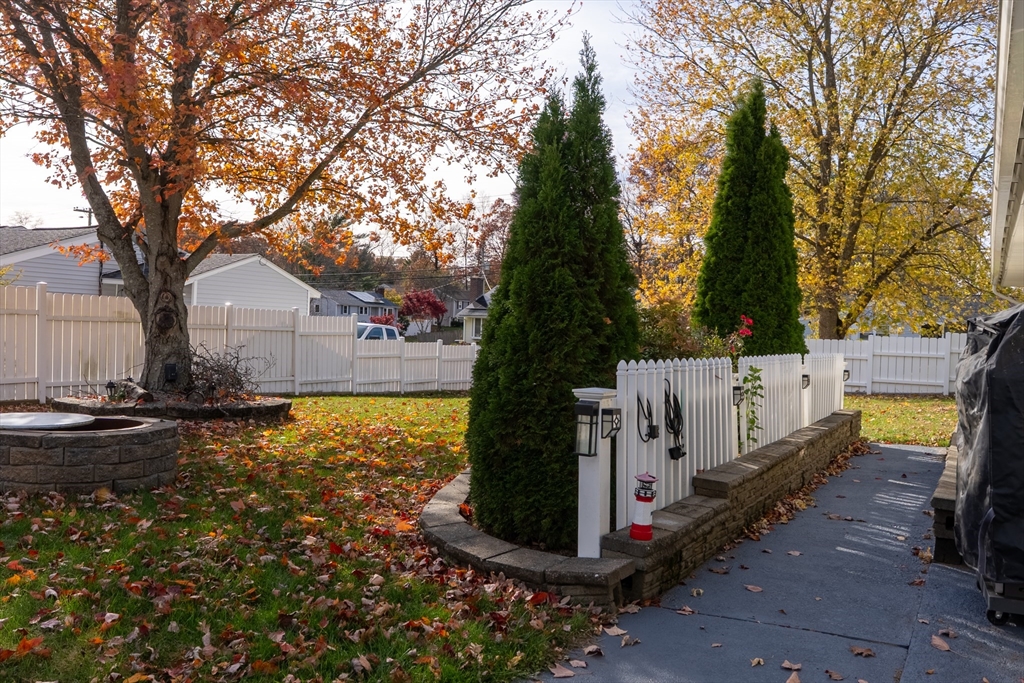 81 Dixon Road Brockton, MA 02302 - Photo 12 of 42 a white house that has tree in front of it