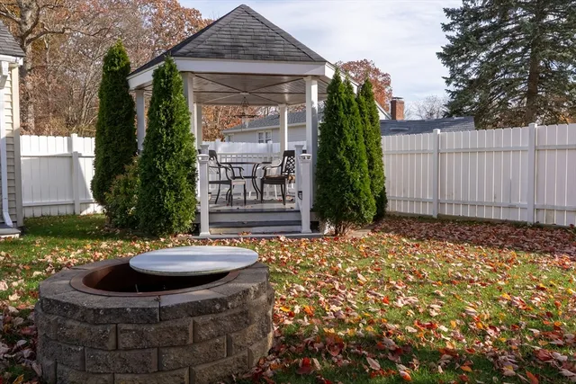 a view of a backyard with plants and a patio