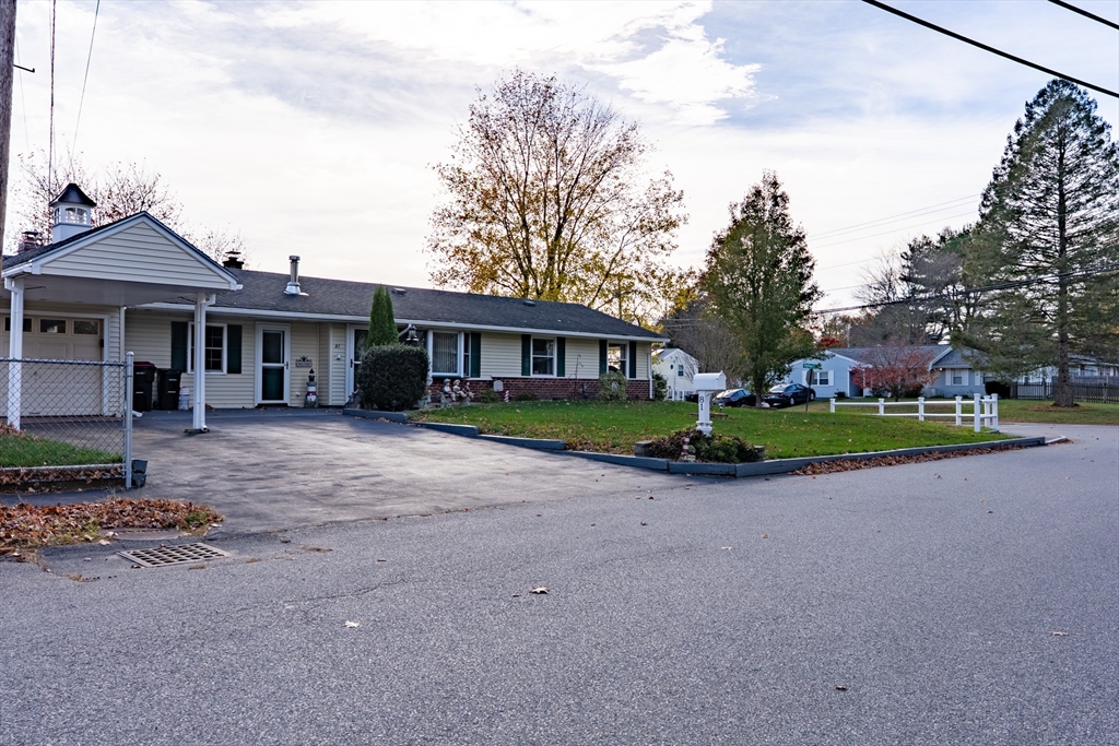 81 Dixon Road Brockton, MA 02302 - Photo 23 of 42 a view of a house with a backyard
