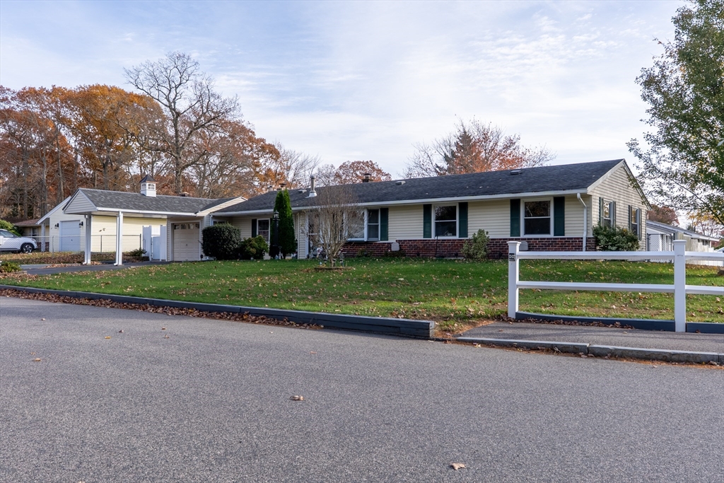 81 Dixon Road Brockton, MA 02302 - Photo 25 of 42 front view of house with a small yard
