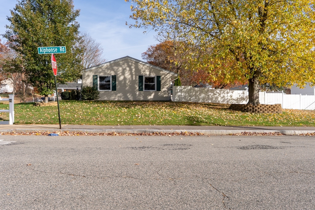 81 Dixon Road Brockton, MA 02302 - Photo 27 of 42 front view of a house with a street
