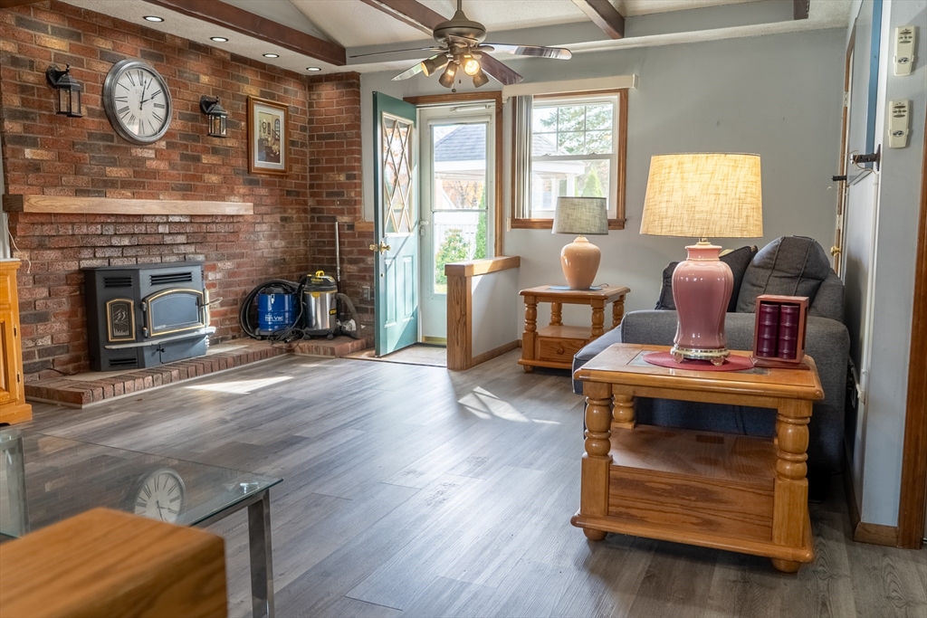 81 Dixon Road Brockton, MA 02302 - Photo 3 of 42 a living room with furniture and a fireplace