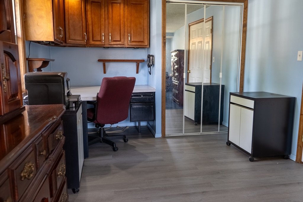 81 Dixon Road Brockton, MA 02302 - Photo 7 of 42 a view of a workspace with furniture and a window