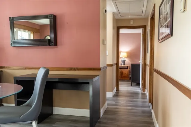 a view of a kitchen from a hallway