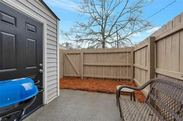 a backyard of a house with seating space