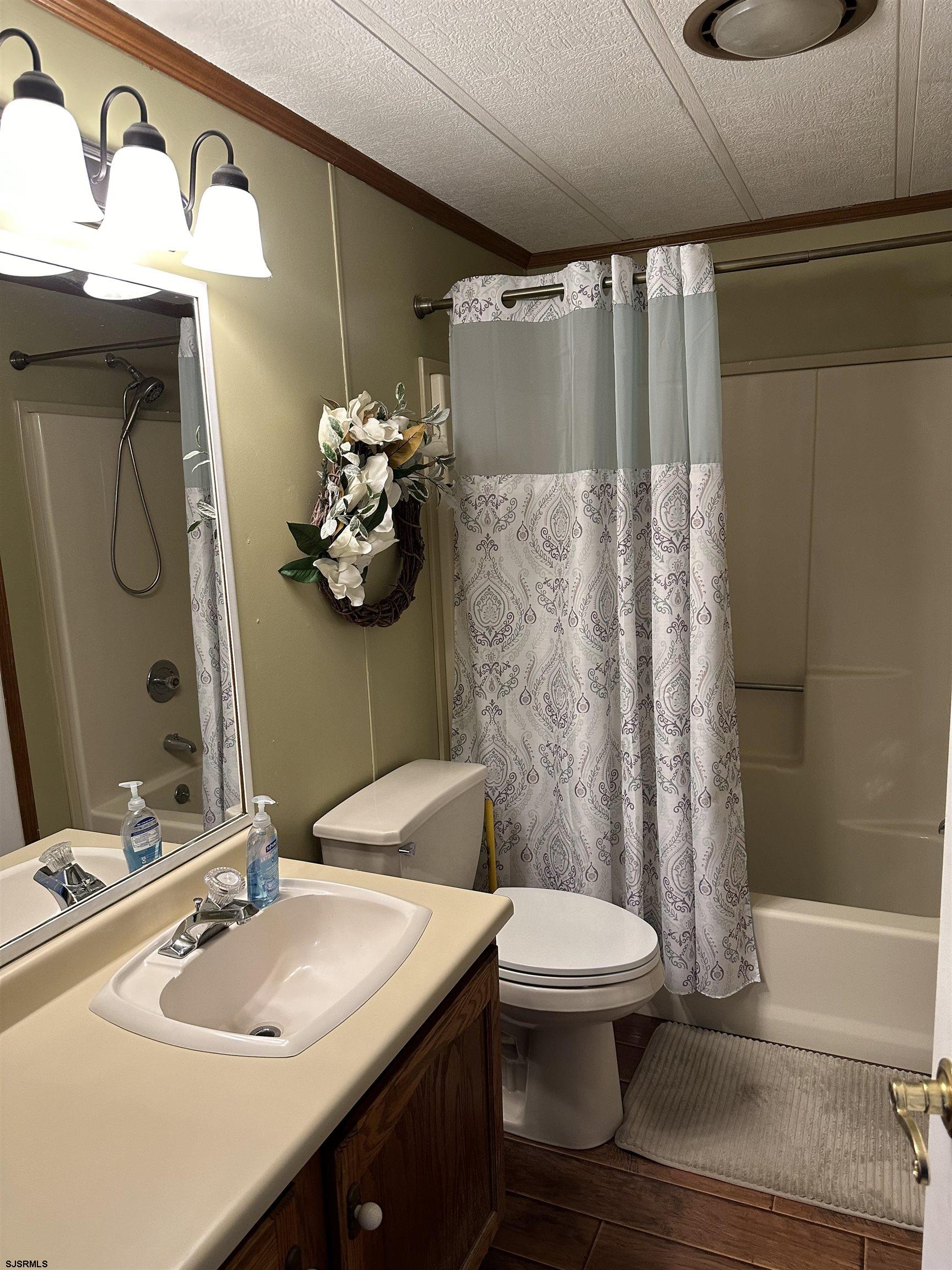 290 Mayflower Drive Buena, NJ 08310 - Photo 12 of 20 a bathroom with a sink toilet and shower