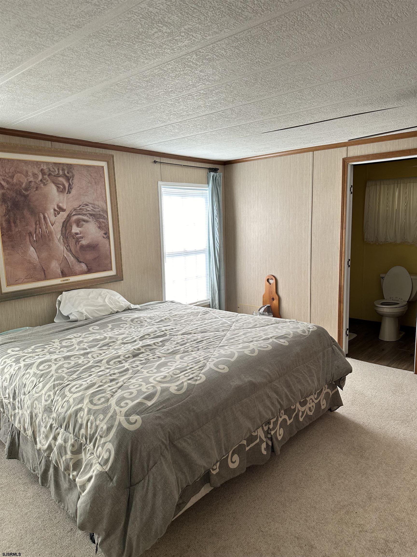 290 Mayflower Drive Buena, NJ 08310 - Photo 15 of 20 a bedroom with a bed and window