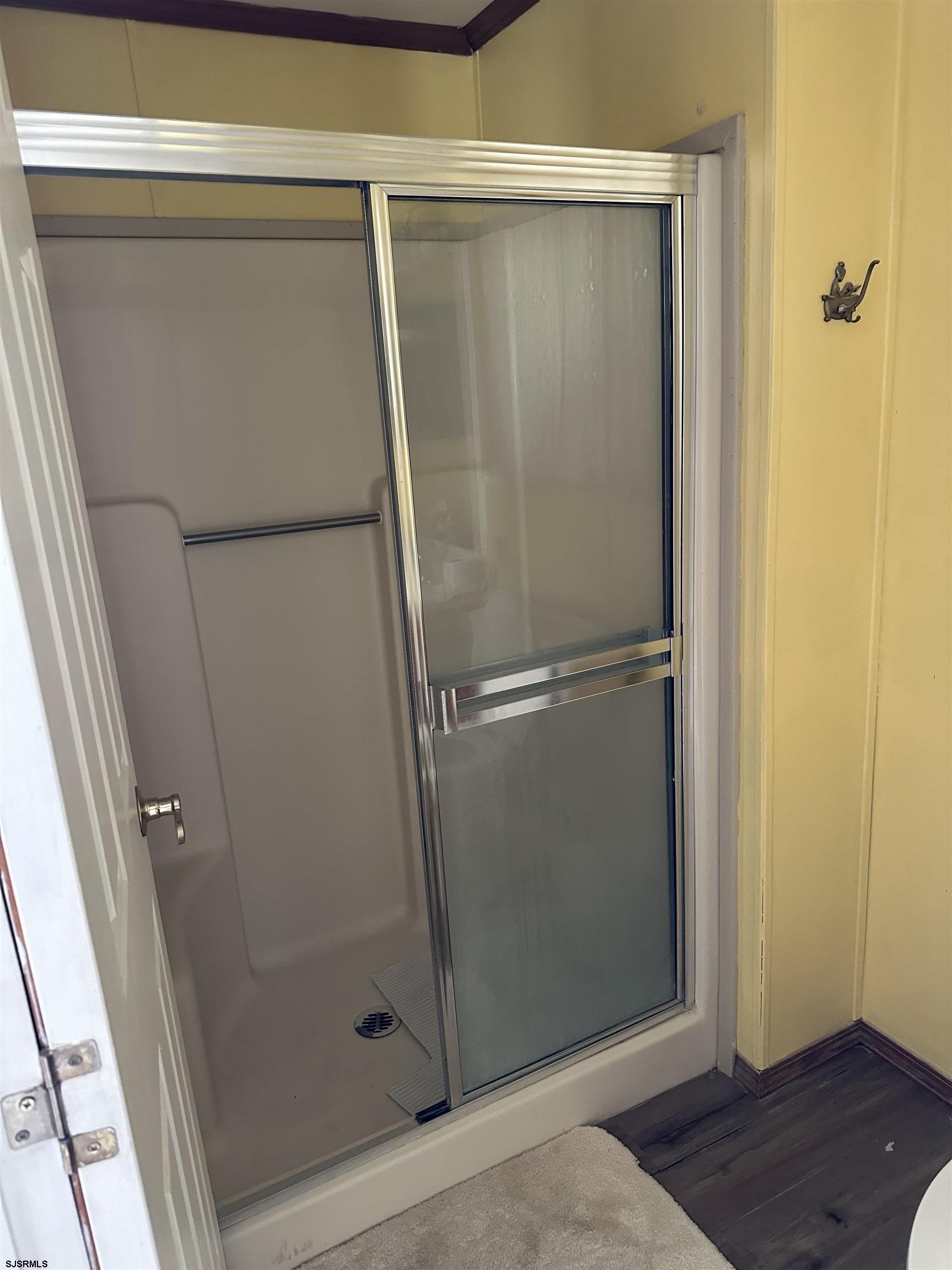290 Mayflower Drive Buena, NJ 08310 - Photo 16 of 20 a bathroom with a glass shower door and a sink