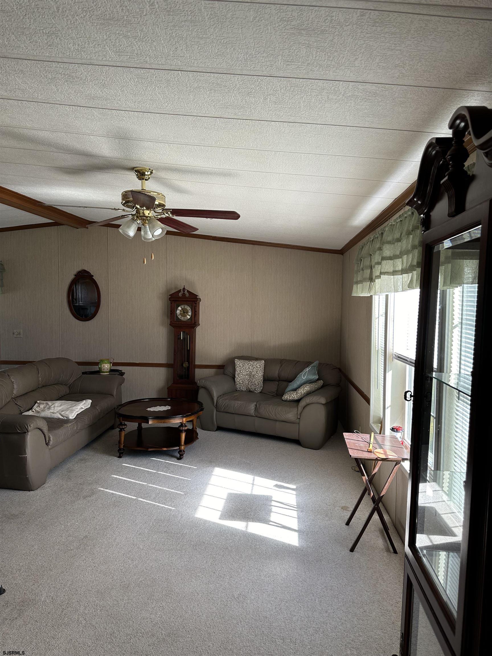 290 Mayflower Drive Buena, NJ 08310 - Photo 4 of 20 a living room with furniture gym equipment and a window