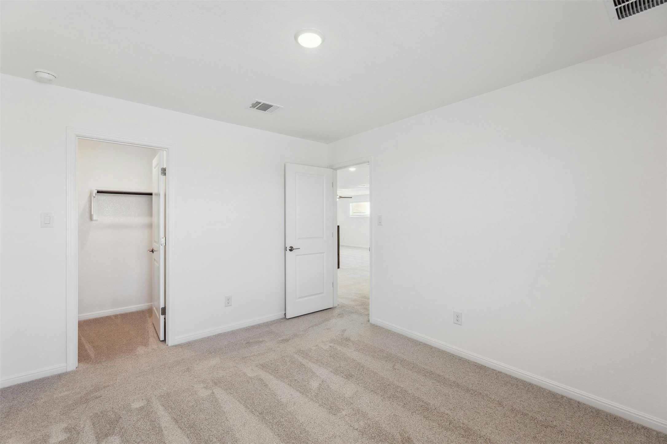 2001 Wynn Road Hutto, TX 78634 - Photo 33 of 39 A well-proportioned bedroom with ample closet space and plush carpeting.