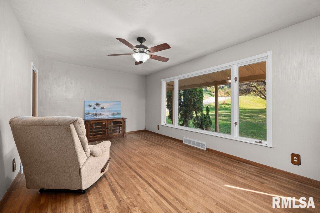 18378 Wells Ferry Road Bettendorf, IA 52722 - Photo 15 of 35 a living room with furniture and a large window
