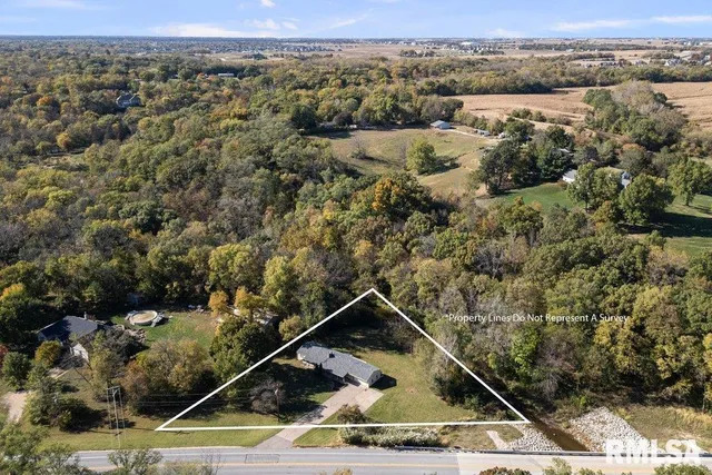 an aerial view of house with yard