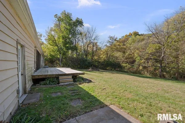 a view of a backyard of the house
