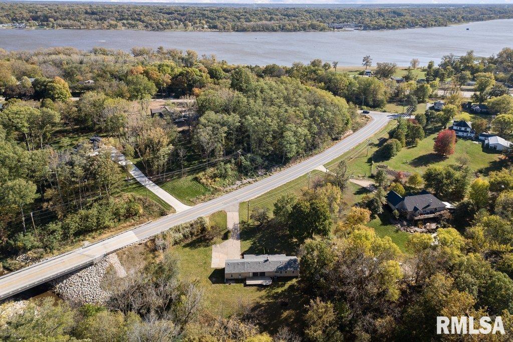 18378 Wells Ferry Road Bettendorf, IA 52722 - Photo 3 of 35 a view of a balcony with wooden floor and a bench