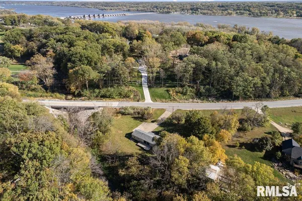 a view of a yard with wooden fence